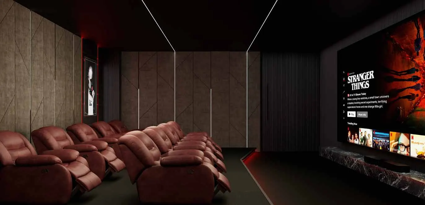 Rows of upholstered recliners facing the screen in Club Florique’s private theatre.